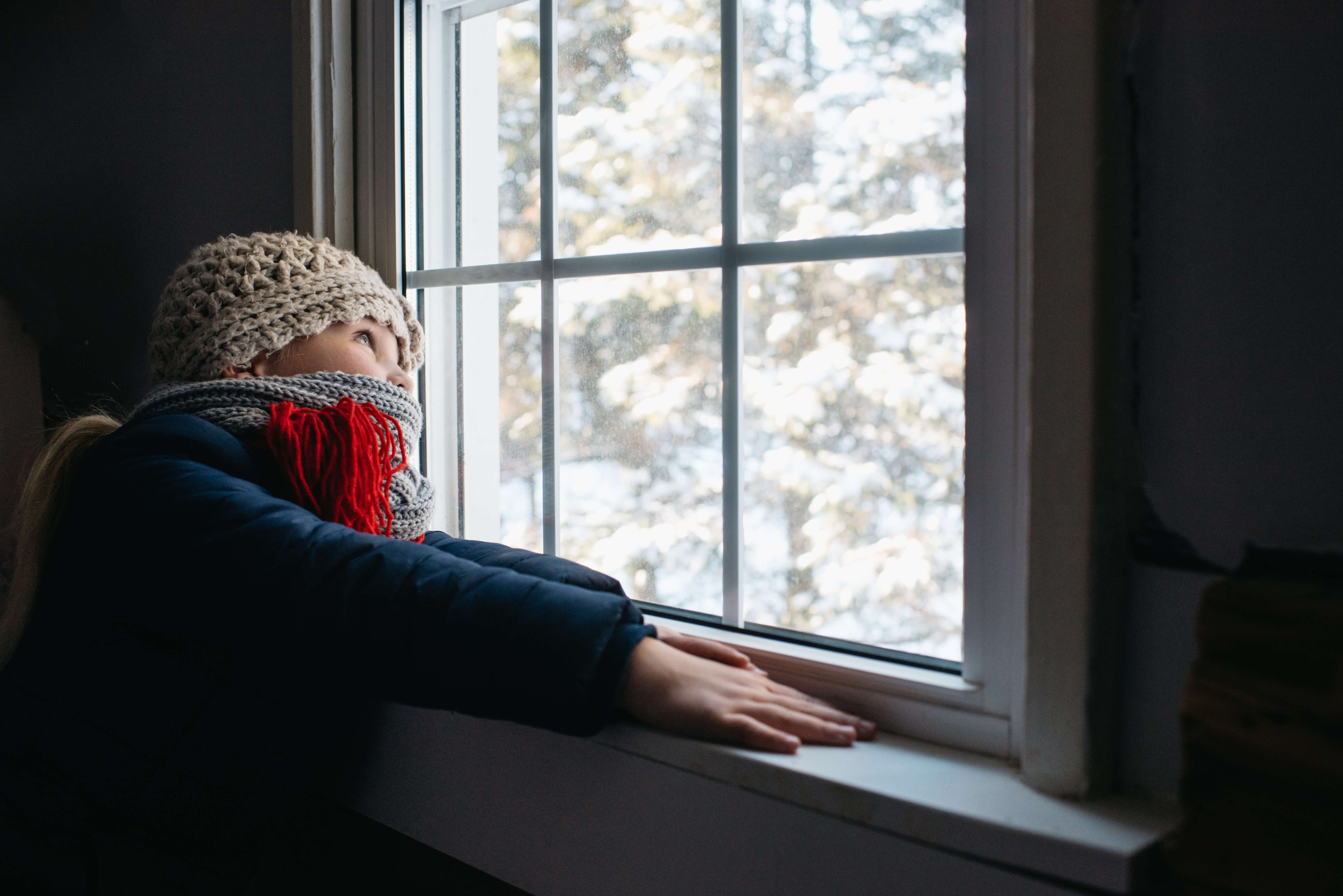 Girl looking out of window