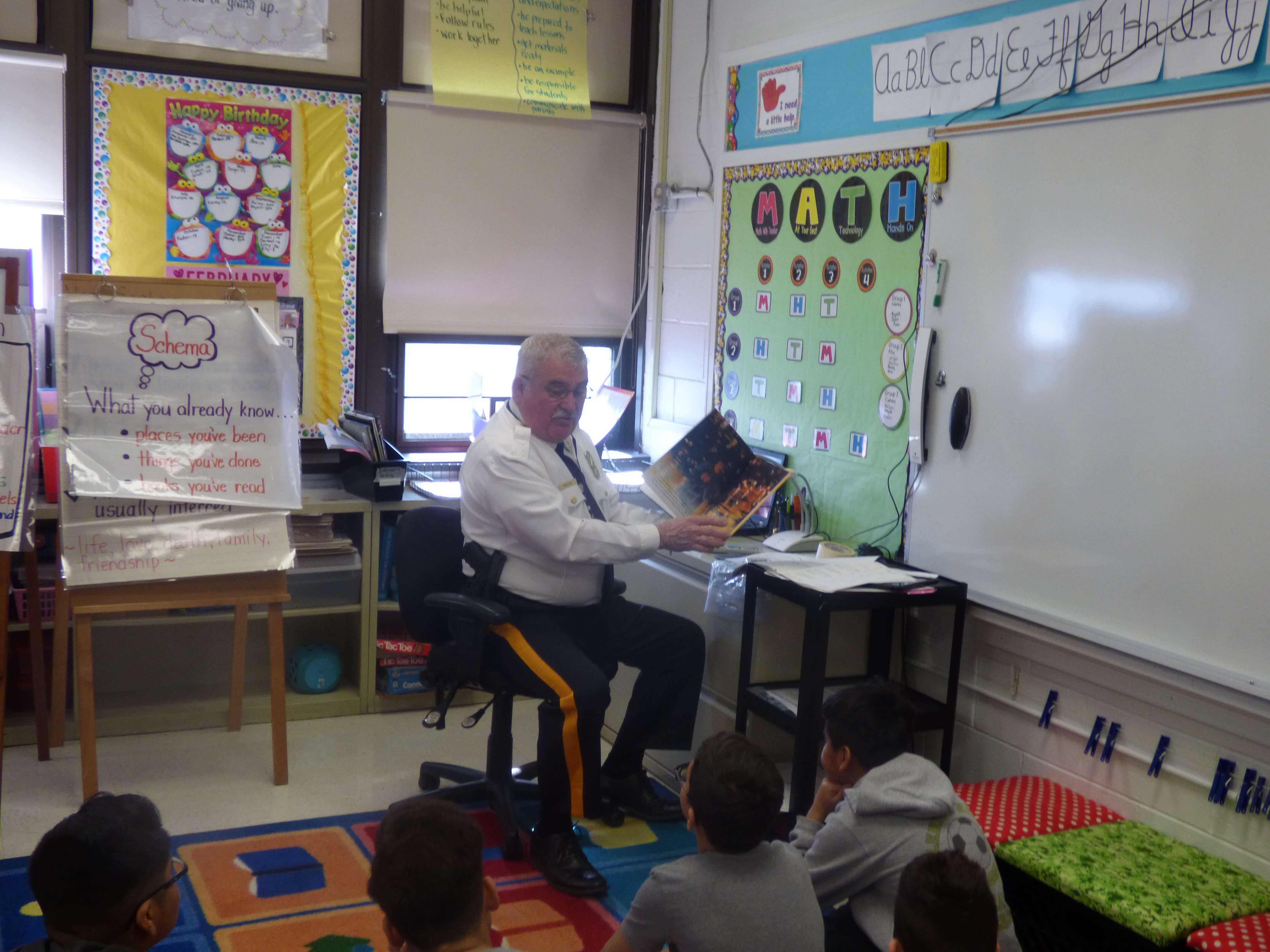 Cape May County Sheriff Robert Nolan reads to Glenwood Avenue Elementary School fifth graders.