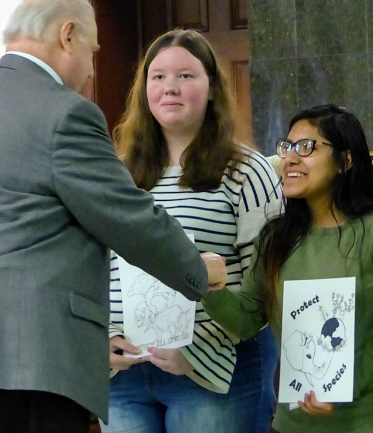 Freeholder Director Gerald Thornton congratulates Odalys Mendoza April 9 for winning first place in the 2019 Earth Day logo contest. Her artwork will be featured on T-shirts at the April 20 celebration. Second-place winner Amber Moore also received congratulations. Moore and Mendoza are students at Cape May County Technical School. Absent was third-place winner Brooke Middleton of Ocean City Intermediate School.