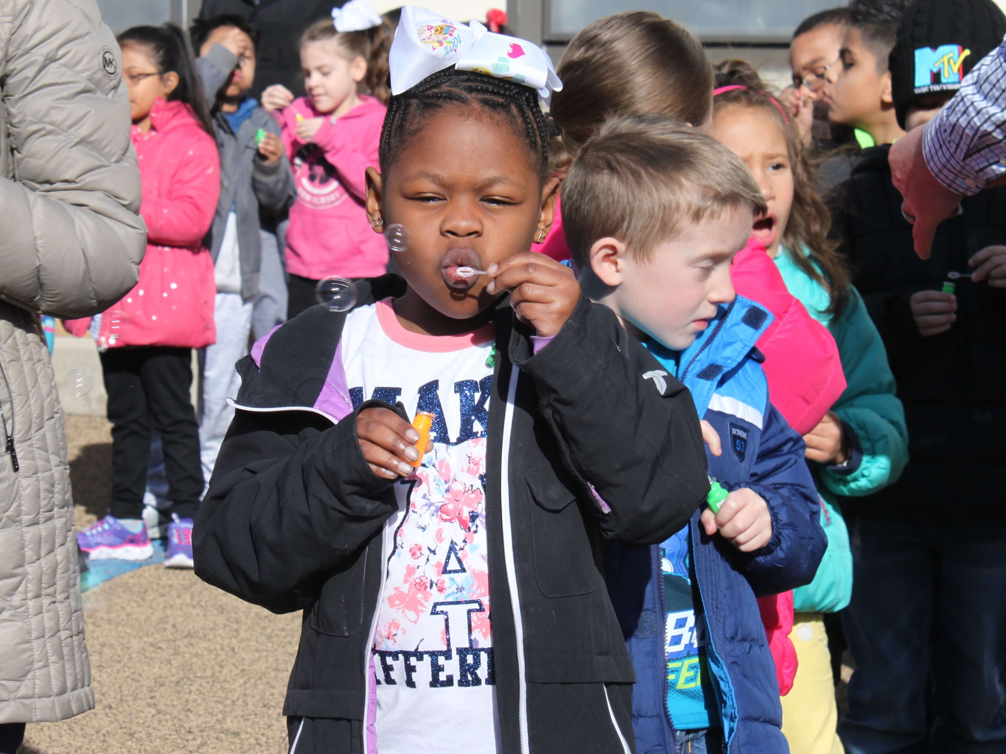 Glenwood Avenue students blow bubbles to raise awareness of autism April 2.