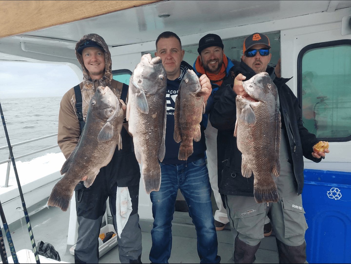 Four happy anglers from opening day on the Cape May Lady. 