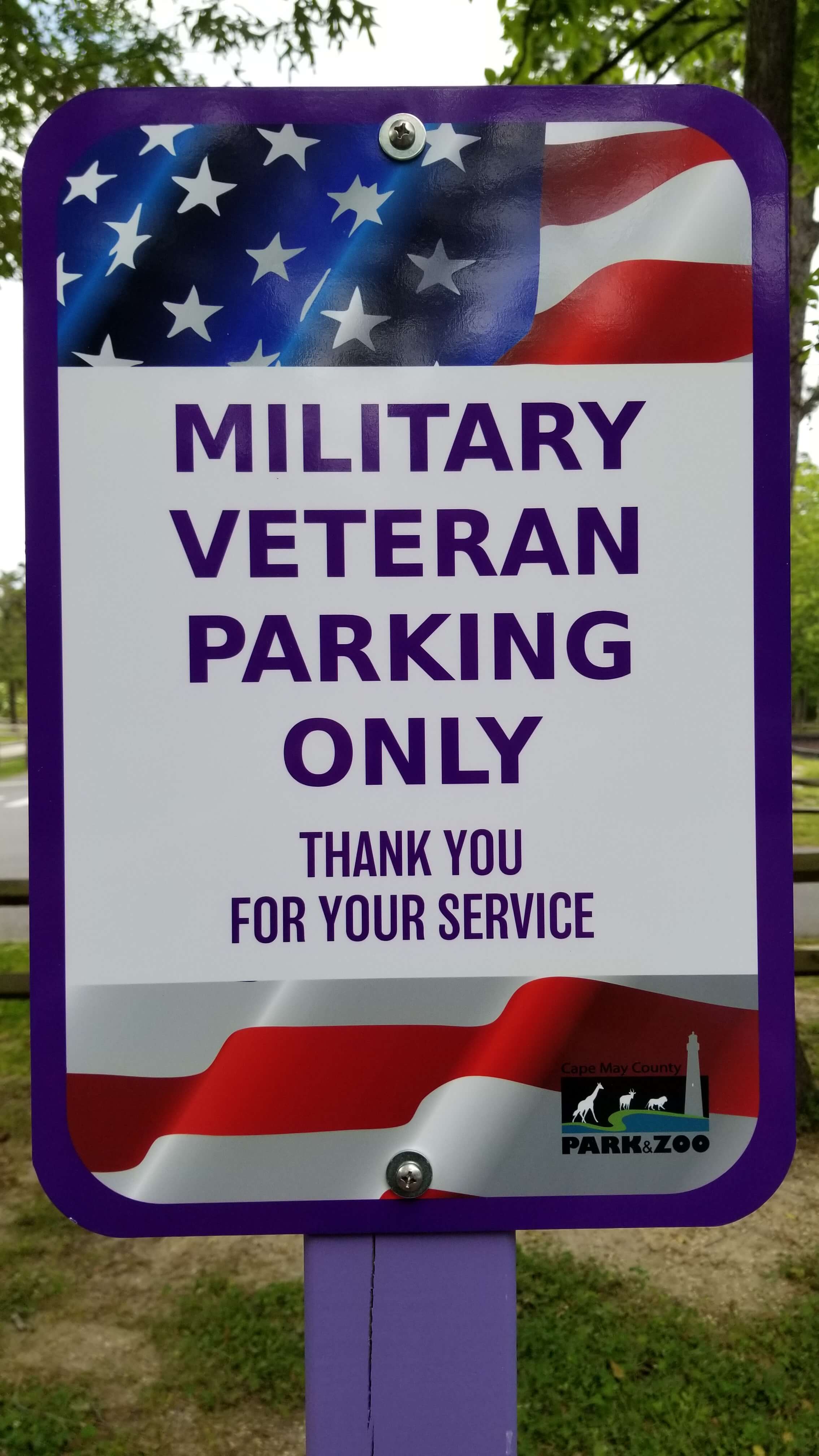 Sign at Cape May County Zoo entrance by one of two parking spaces reserved for military veterans.