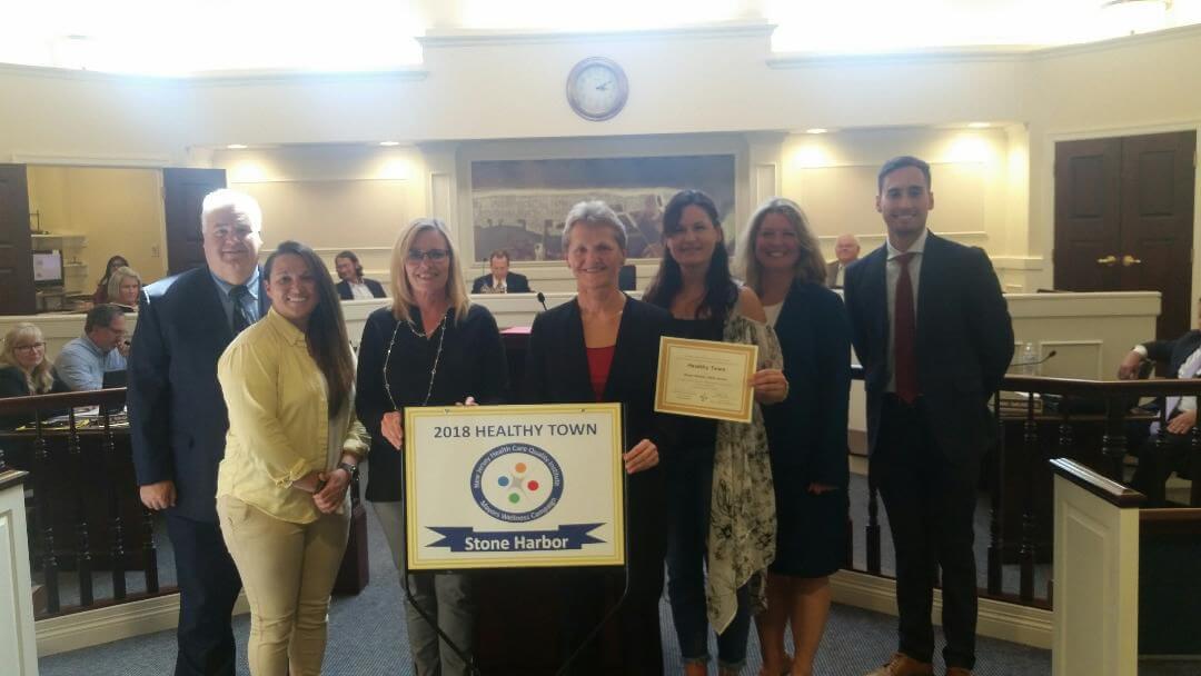 Stone Harbor received the Healthy Town award from New Jersey Health Care Quality Institute. From left