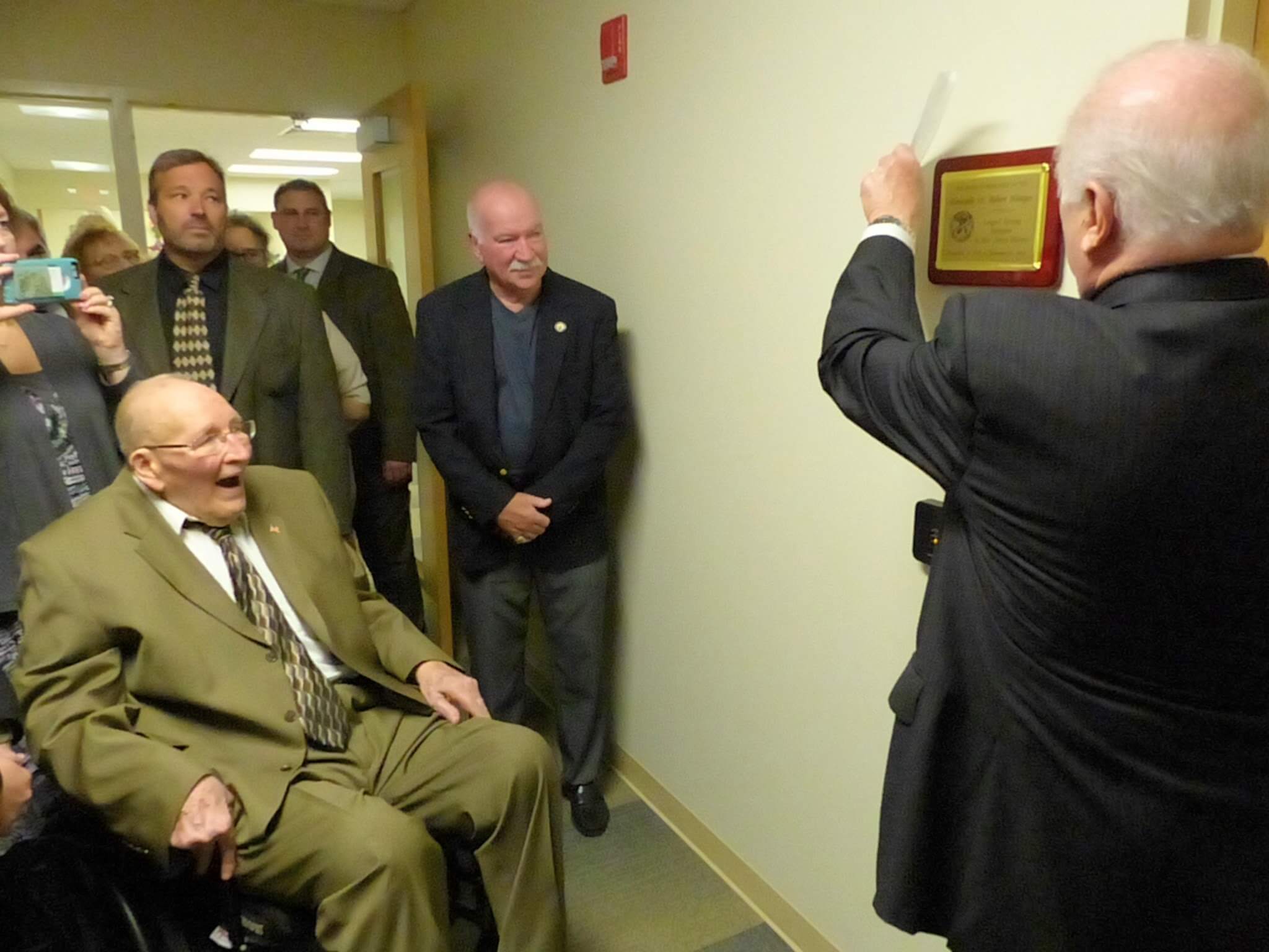 Freeholder Director Gerald Thornton unveils plaque May 3 that names a conference room in the Surrogate's Office to honor former Cape May County Surrogate W. Robert Hentges