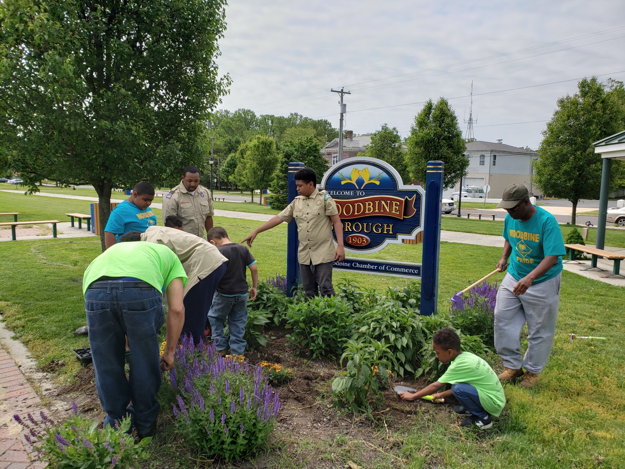 Woodbine Boy and Cub Scout Troops 77 plant flowers to help beautify the borough.