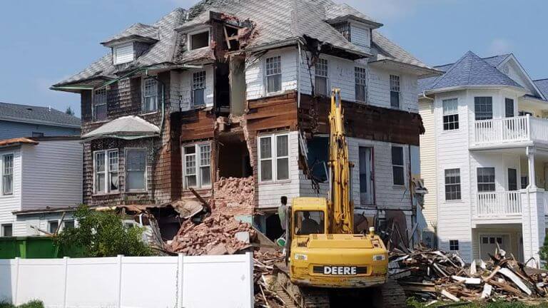An 1890s Victorian house is demolished in the fall of 2018.