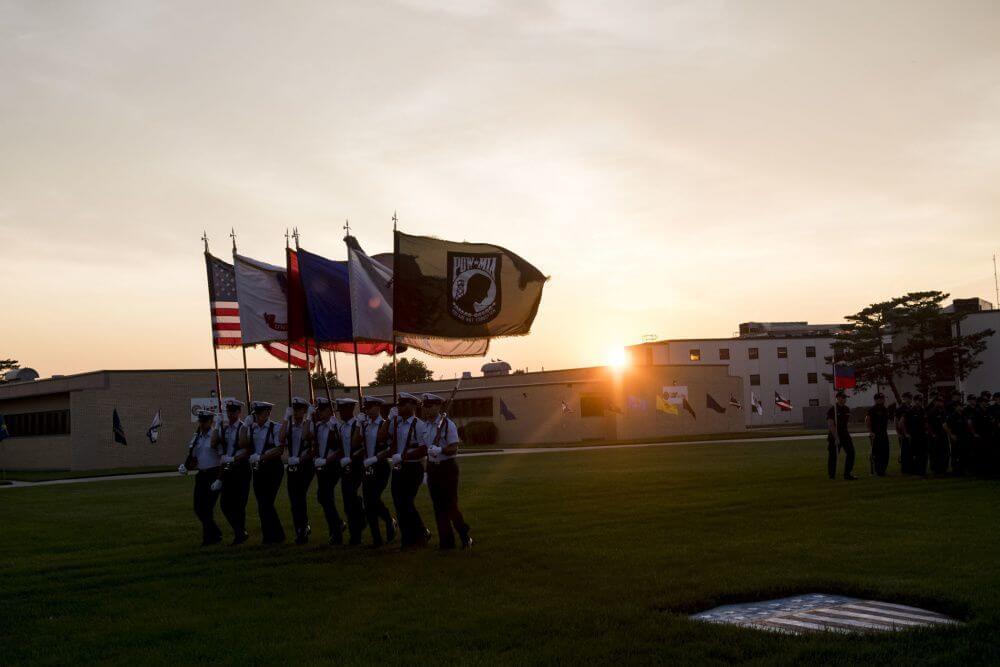 Coast Guard Recruits march onto Training Center Cape May's Parade Field during a Sunset Parade July 1