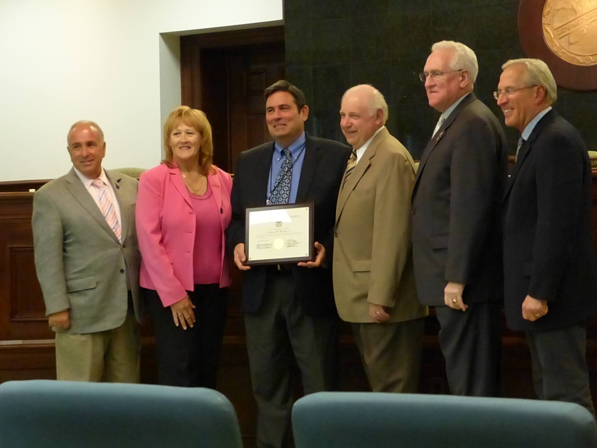 Freeholders recognize George R. “Ray” Brown III May 28 on his retirement as administrator of the county Tax Board. Pictured from left are