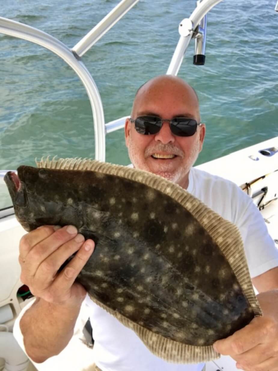 Brian Collings and his 22.5-inch flounder