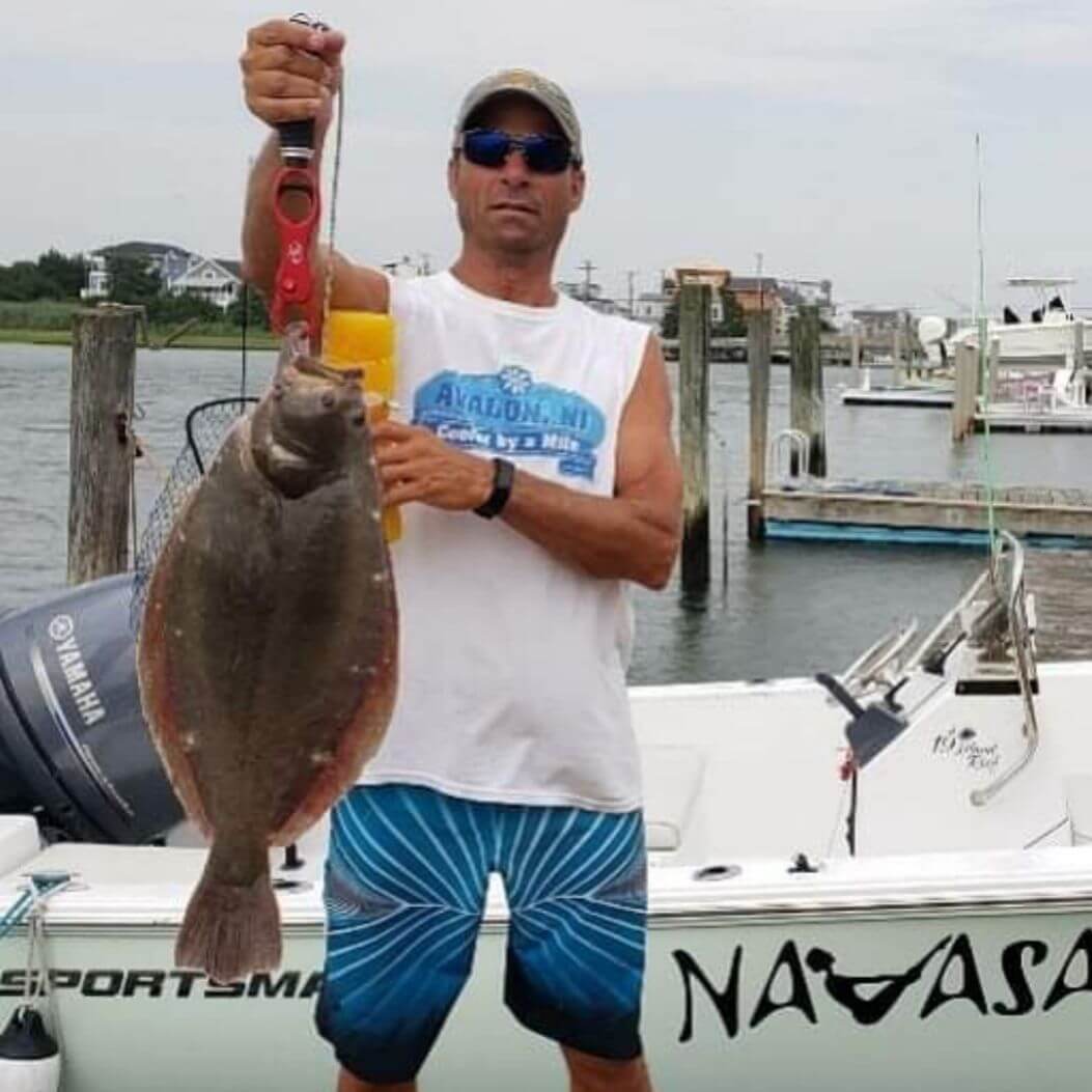 Jonathan S. and his 24.5-inch fluke.