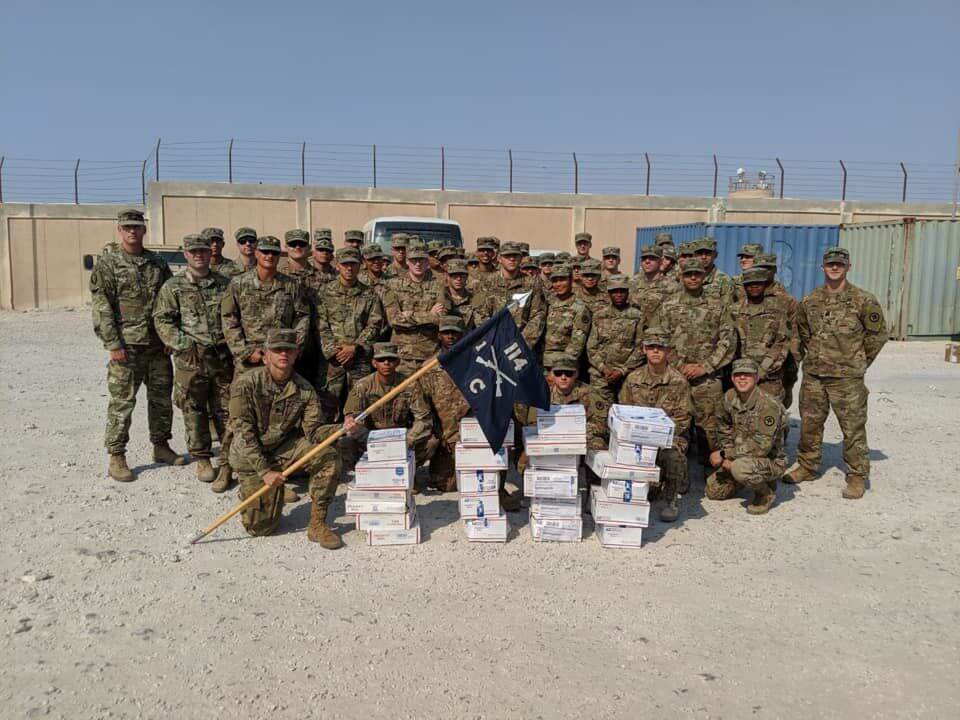 Deployed troops with CARE packages sent by Cub Scout Pack 65 Court House.