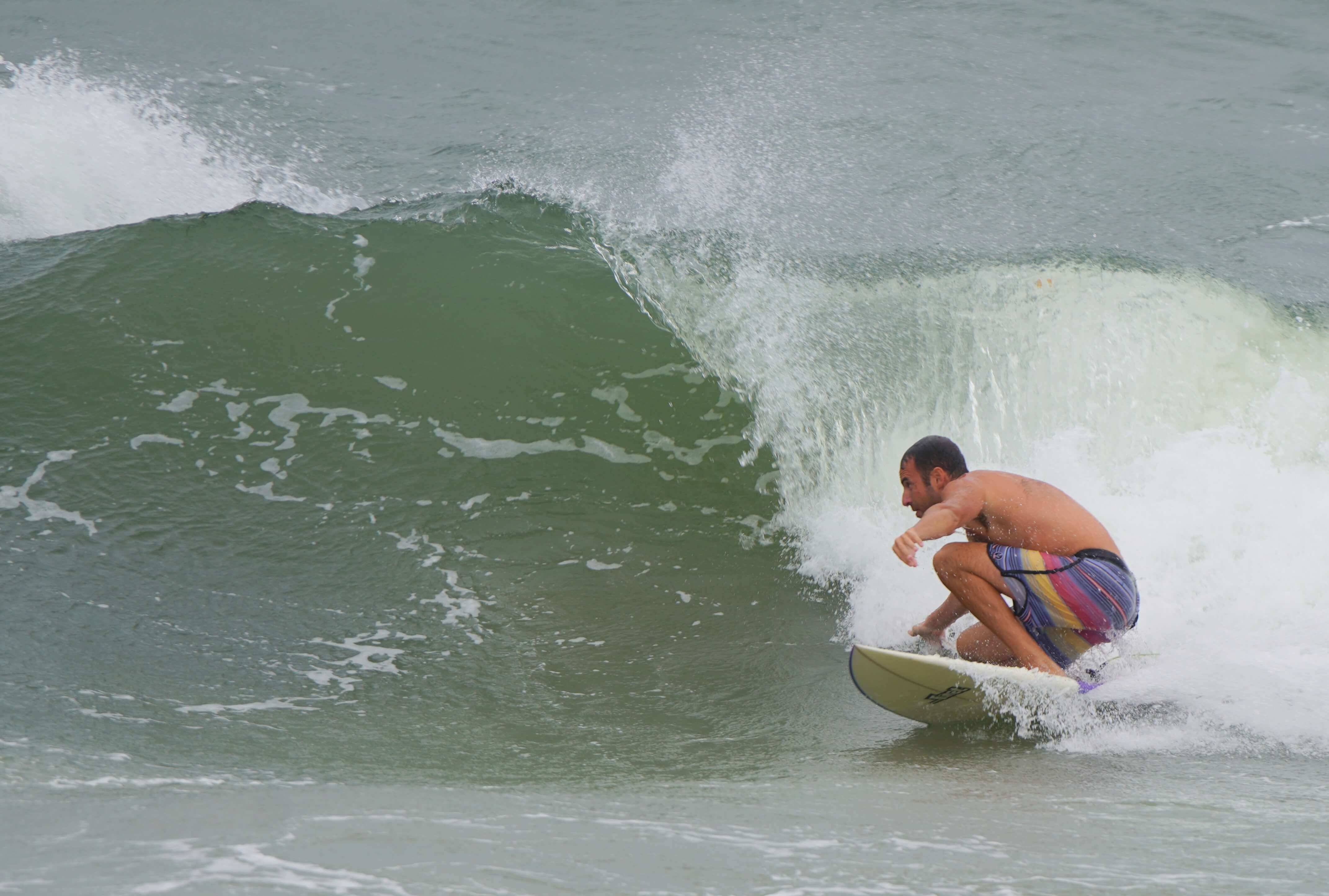 Surfer rides larger than normal wave Sept. 5 in North Wildwood.