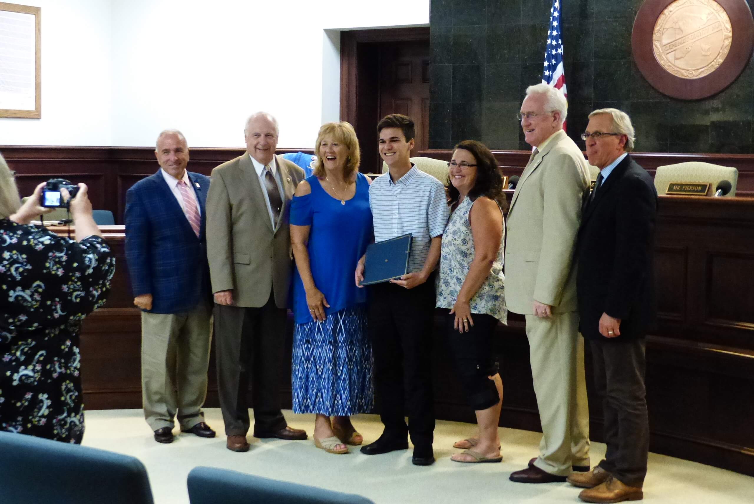 Joseph Verdade and his mother with freeholders Aug. 13. They are