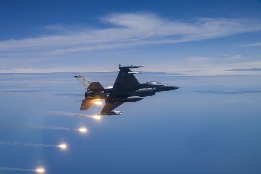 A U.S. Air Force F-16C Fighting Falcon fires flares over the Atlantic Ocean after performing a flyover for the 2019 Atlantic City Airshow