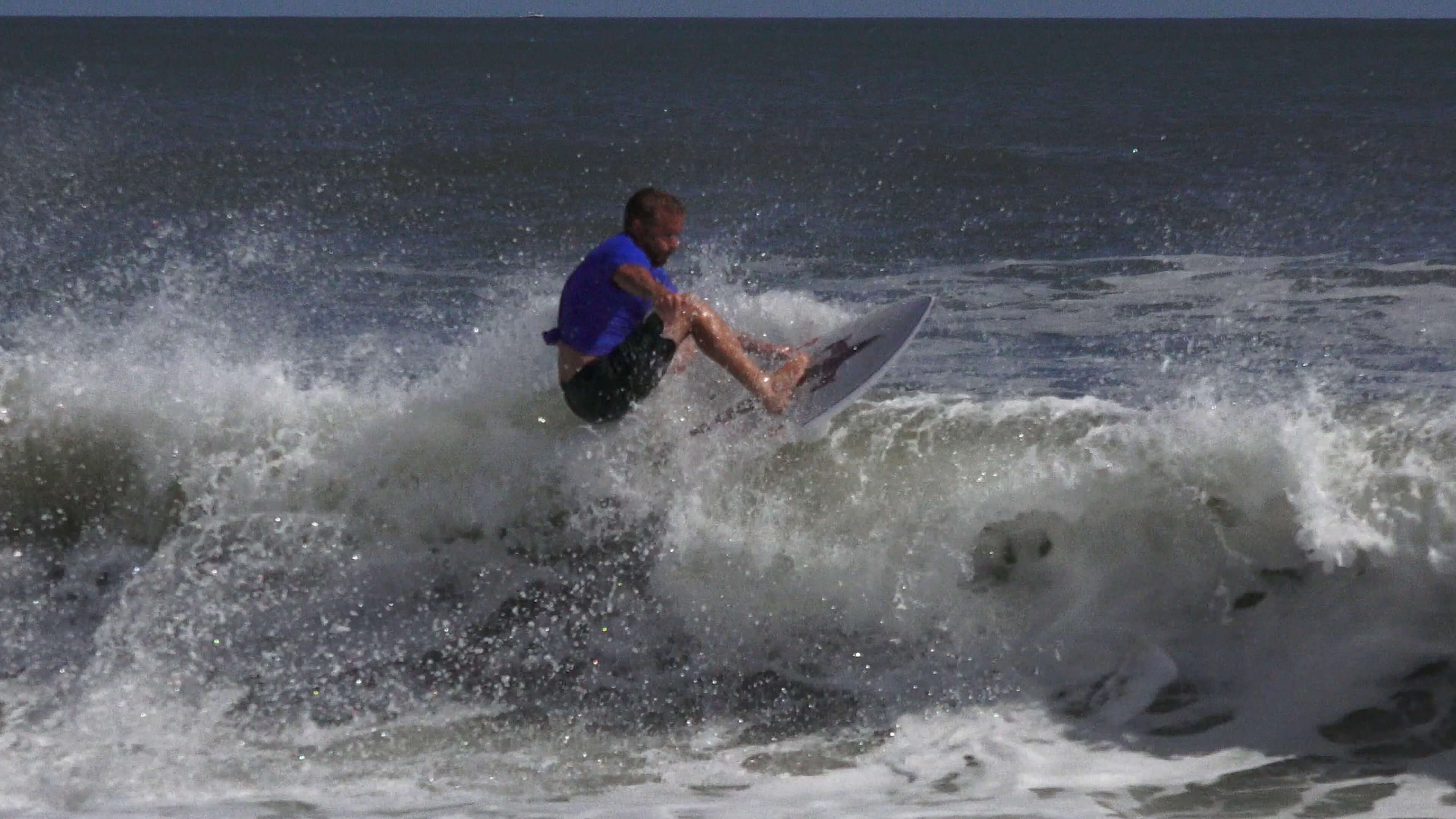 Local professional surfer Ian Bloch of Margate surfs for the winning team