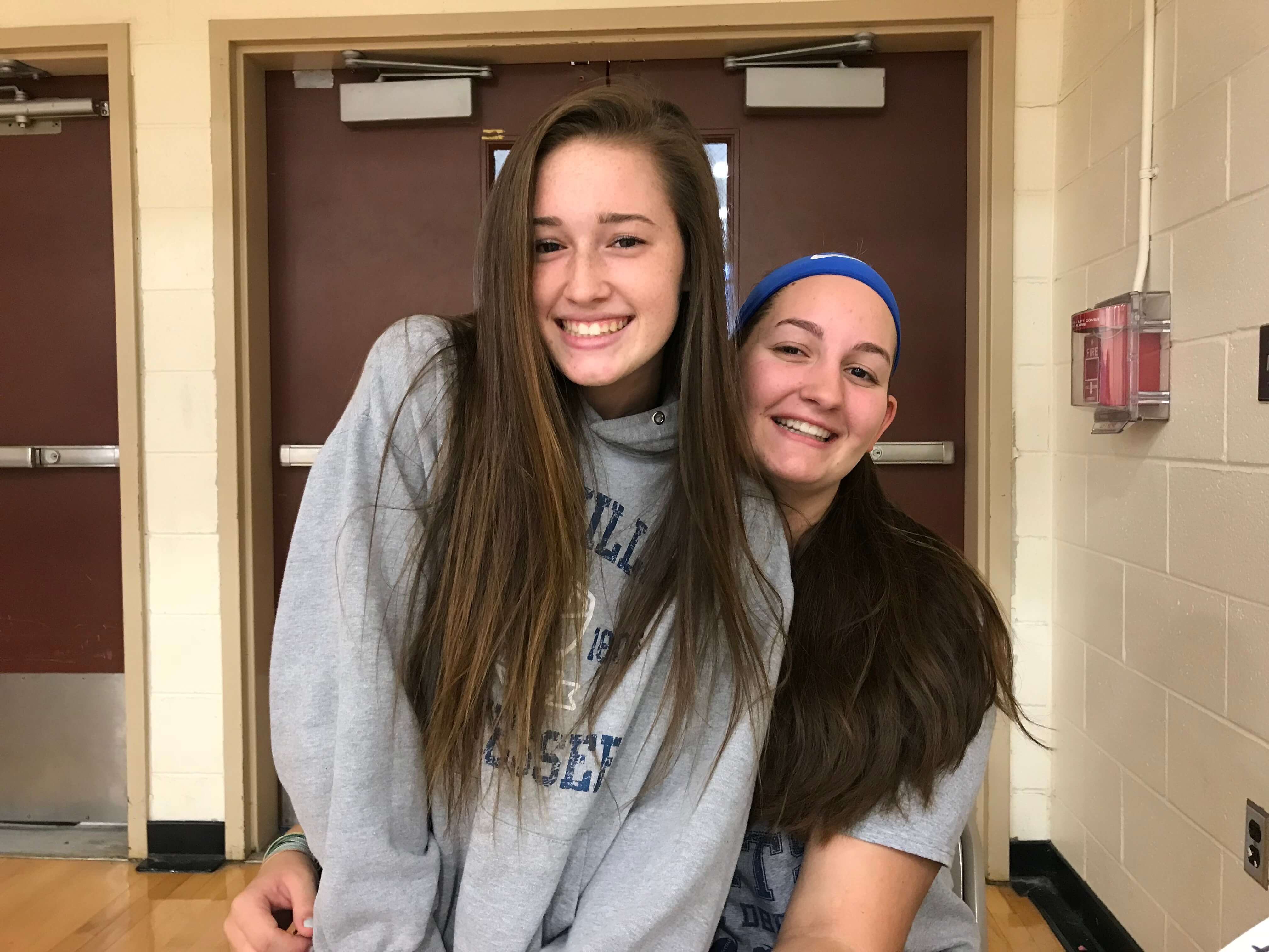 Captains Shaye Fletcher (left) and Emma Muldoon (right) pose for a photo together inside the gymnasium at Lower Cape May Regional High School.