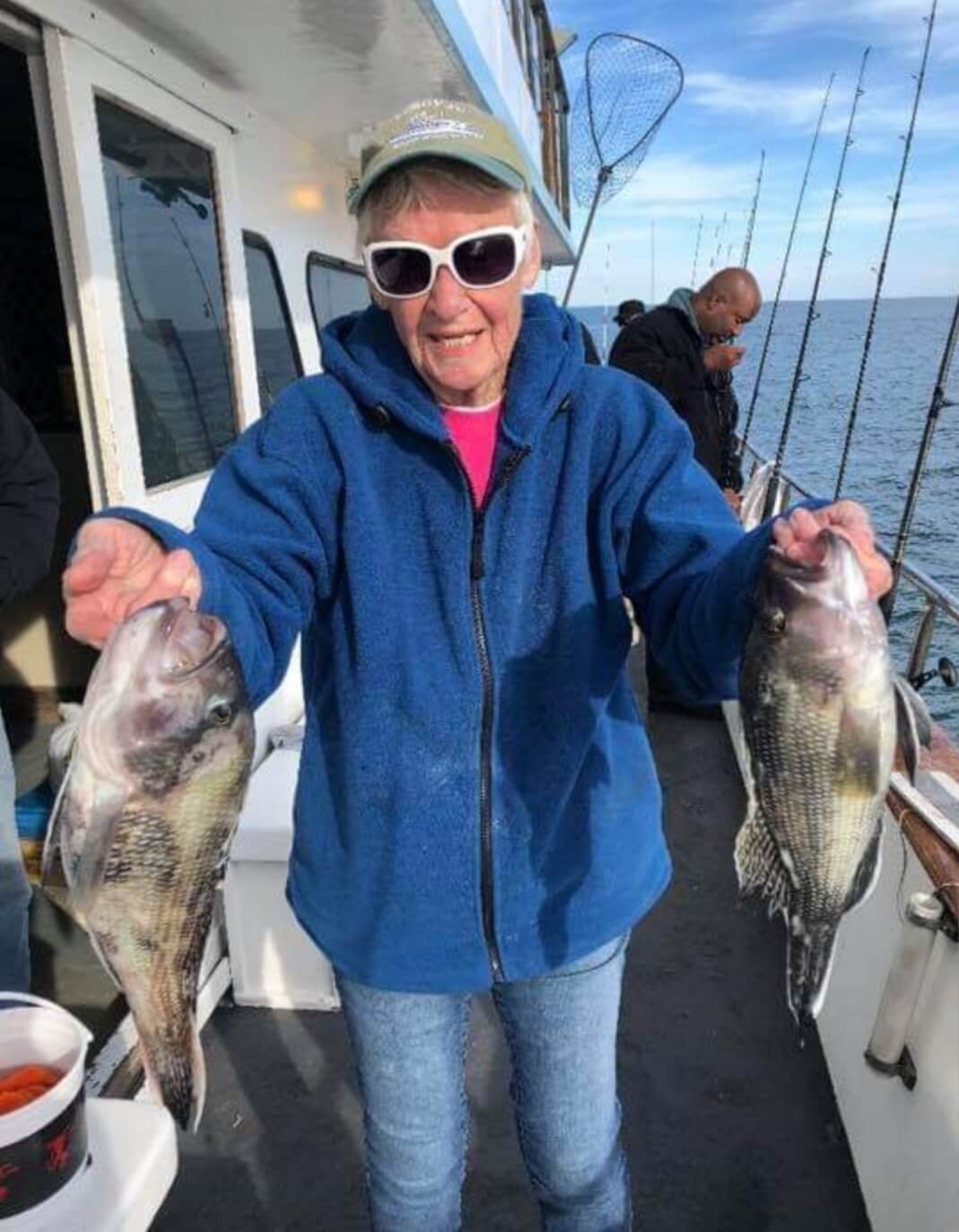 Joann Pettit and two nice keeper sea bass.