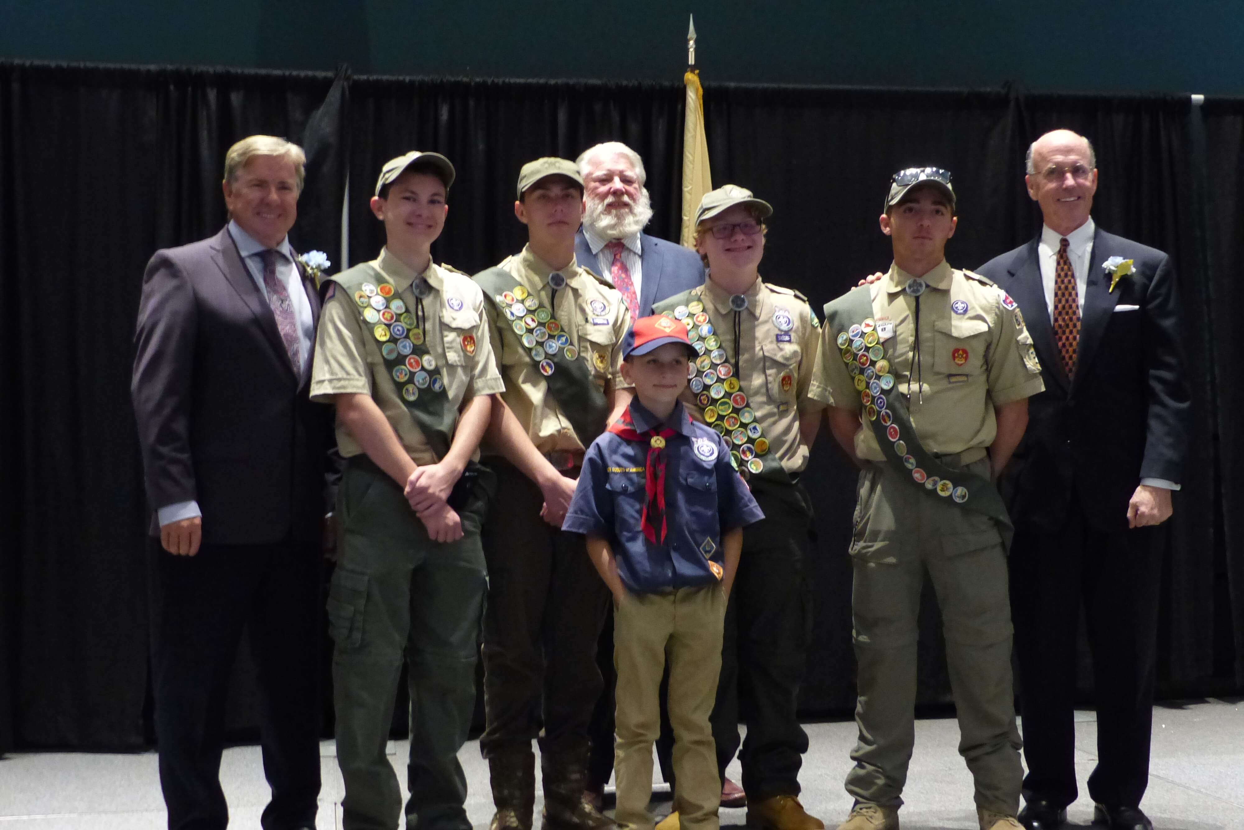 Patrick Healey (far-left) and Eustace Mita (far-right) pose for a photo with scouts of Cape May County after being recognized as Distinguished Citizens of the Year.