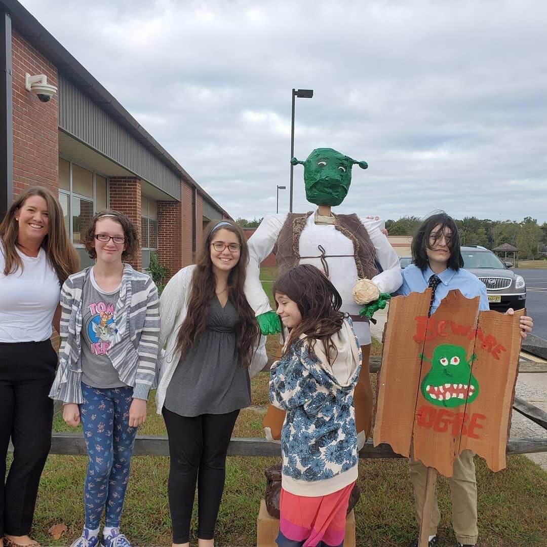 The DTMS Student Government Shrek Scarecrow Committee included advisor Amanda Unkle