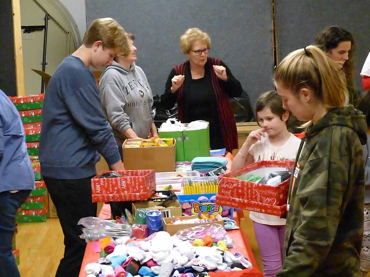 Operation Christmas Child shoeboxes are packed Nov. 17 at First united Methodist Churc of Cape May Court House by congregation members and friends.