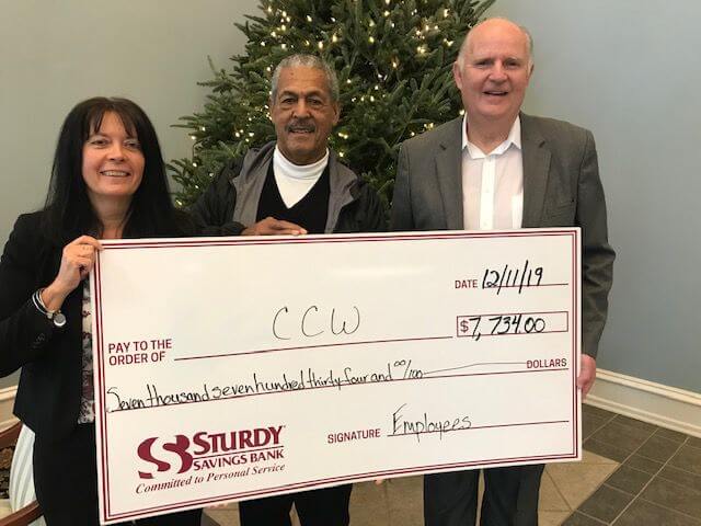 Sturdy Saving Bank’s Executive Vice President/Director of Human Resources Trina McSorley (left) and President and CEO Gerald L. Reeves (right) present a check