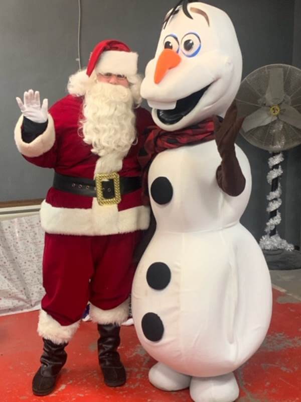 Santa and Olaf share a photo opportunity at Woodbine's holiday parade.