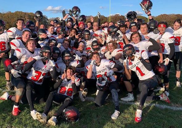 The Ocean City Red Raiders football team celebrated winning a rematch against Mainland