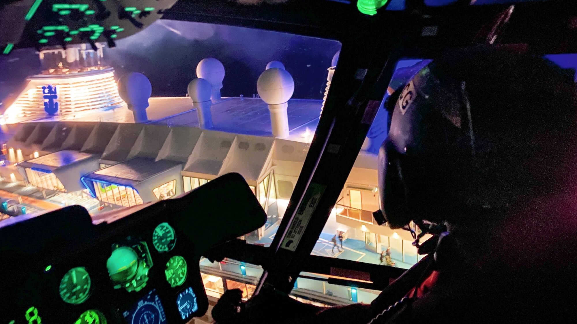 A Coast Guard aircrew aboard an MH-65 Dolphin helicoper From air Station Atlantic City medevac a man from the cruise ship Anthem of the Seas