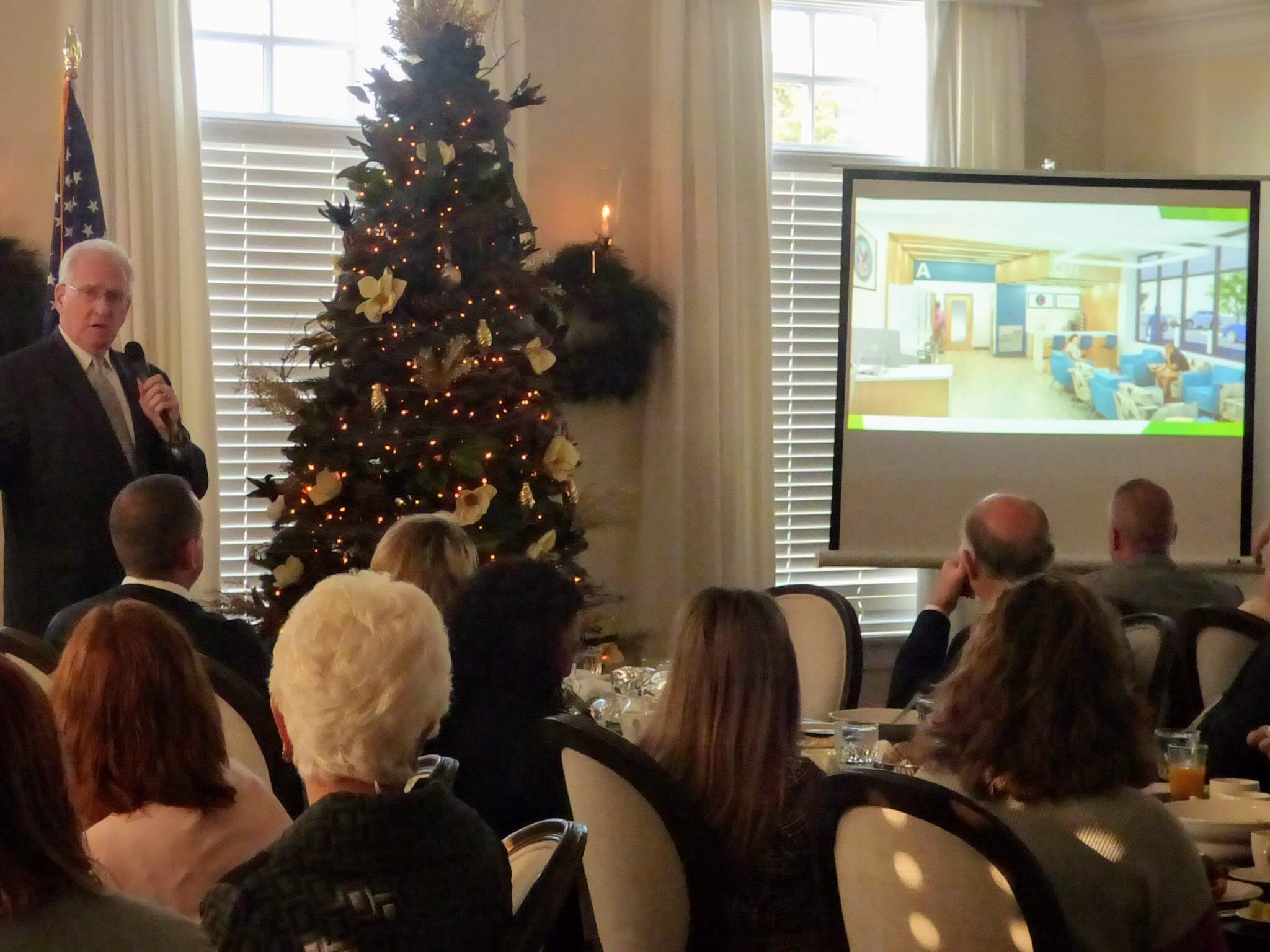 Freeholder Jeffrey Pierson shows an artist’s rendering of the inside of the veterans’ clinic at the Nov. 21 Cape May County Chamber of Commerce meeting. The clinic is expected to open in April 2020.