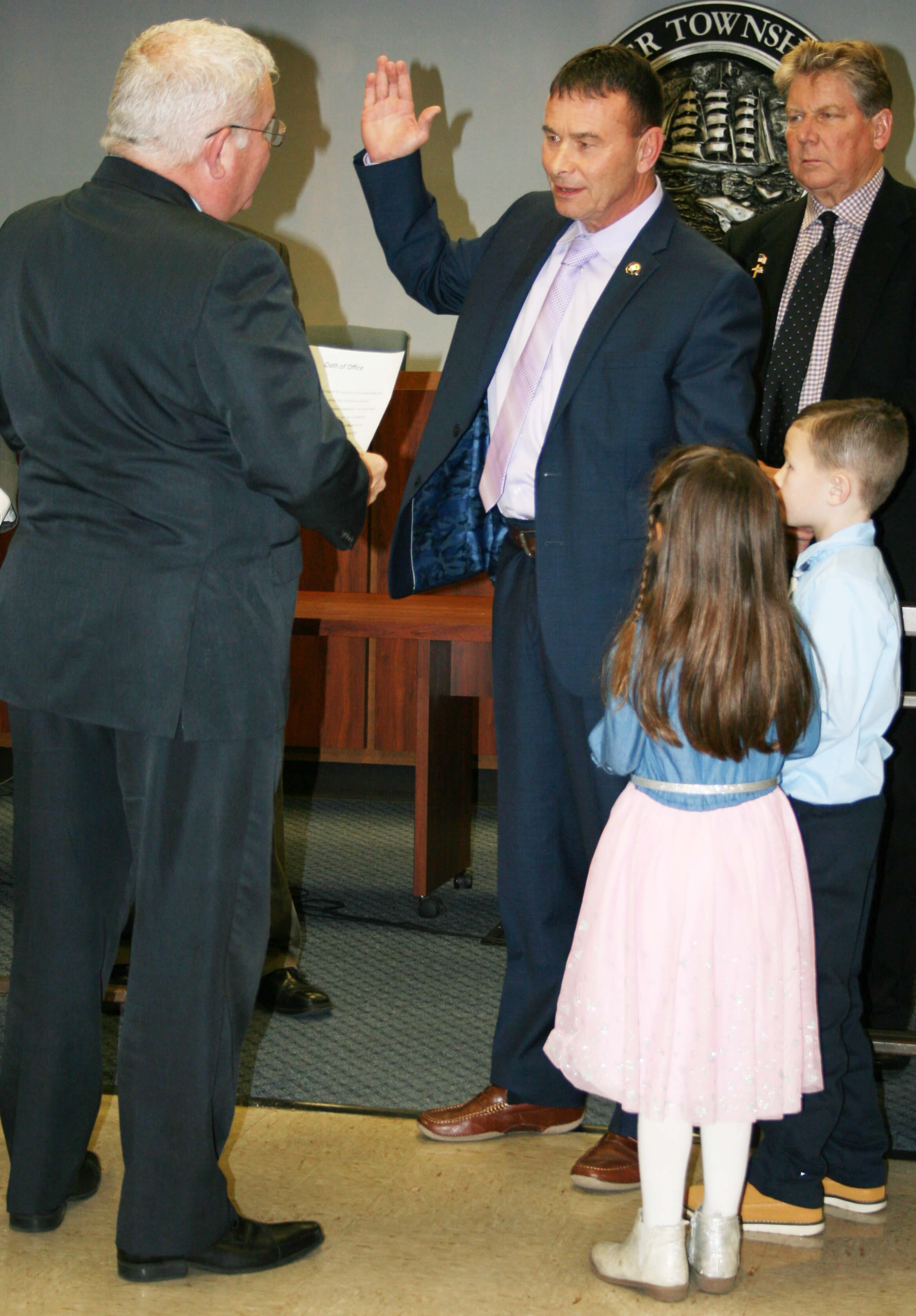 Lower Township Mayor Frank Sippel takes his oath of office from Cape May County Sheriff Robert Nolan