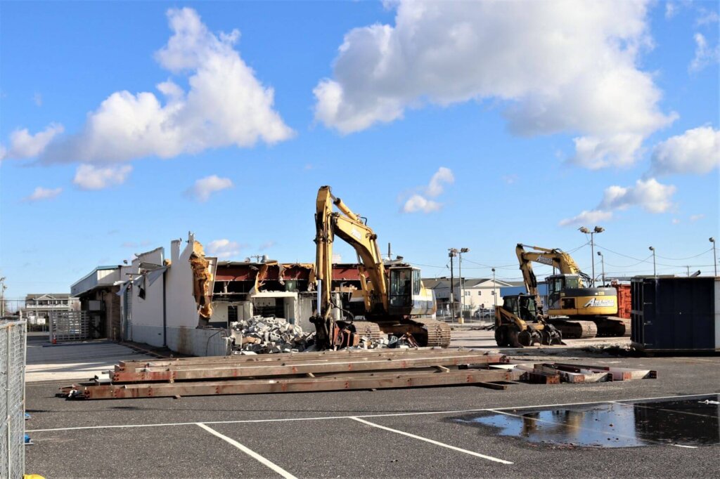A file photo shows demolition of a former car dealership. Plans call for the area to be used as open space