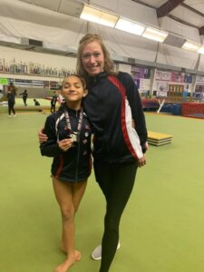 Art of Gymnastics & Cheer Celebrate Wins at First Meet of the Season