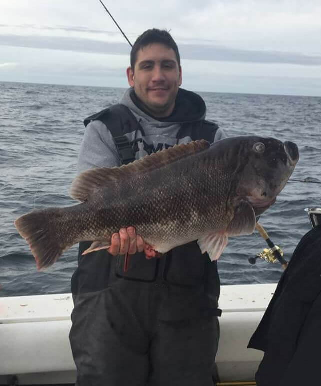 Ted Gill and his 16.4-pound blackfish.