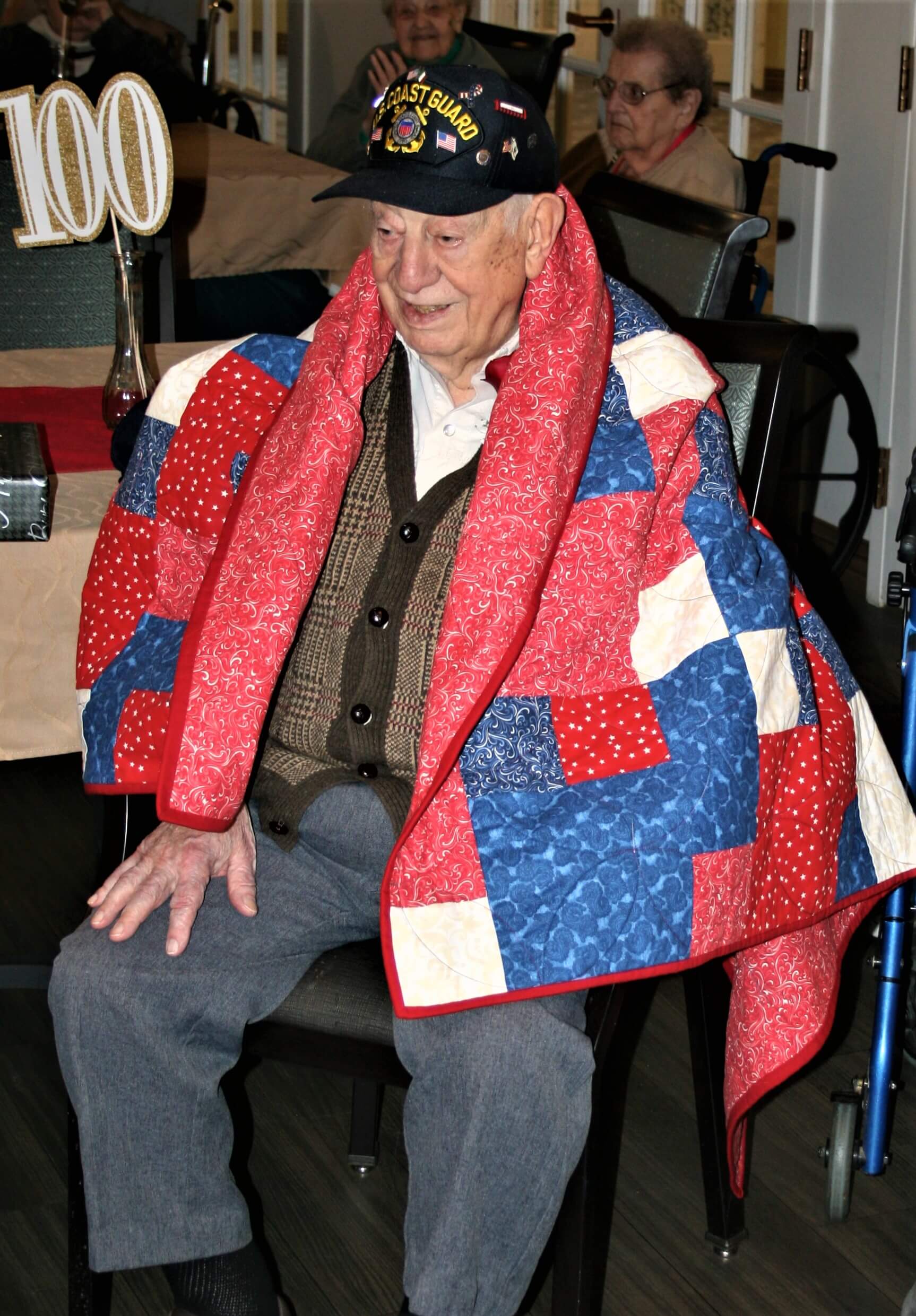 Centenarian Joseph Somma wears Quilt of Valor presented by the South Jersey Chapter Quilts of Valor for his service during World War II.