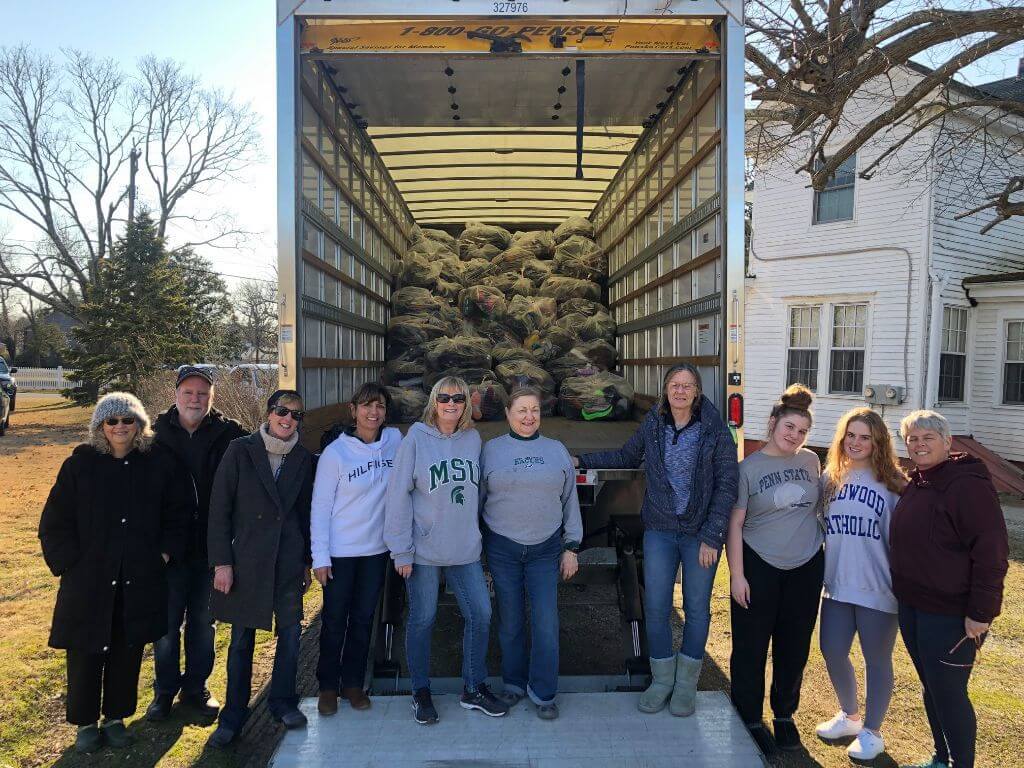 Volunteers who helped collect and load shoes into truck. The shoes will benefit Our Lady of the Angels Church missionary team that will erect a dwelling in Guatemala this summer.