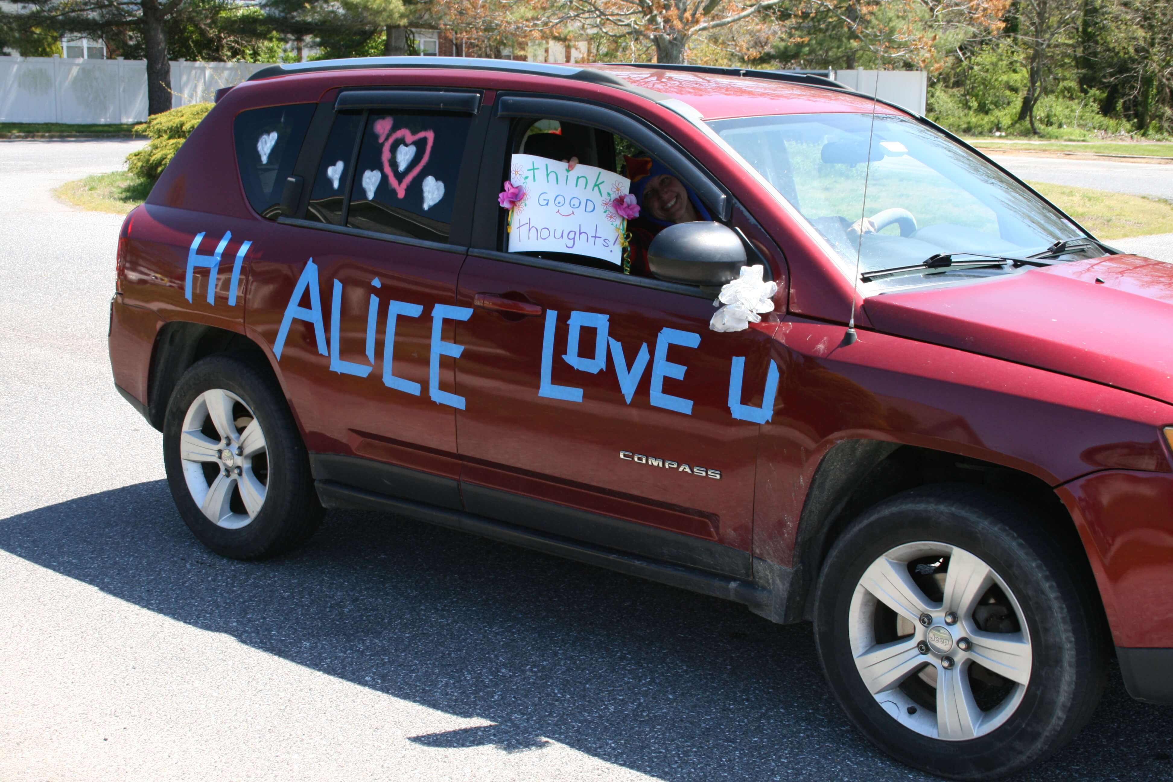 About 30 vehicles took two laps around the Victoria Commons assisted living facility to cheer up residents and send messages of love.