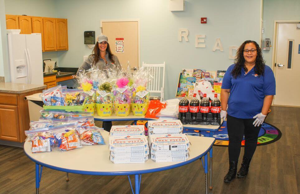 Cape Assist staff Jessica Leonard Staley and Chelymarie Reyes ready to begin deliveries of Easter baskets and treats.