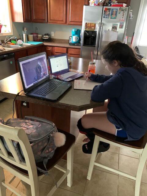 Emma Oravitz multitasks as she completes her math work and socializes on Google Hangouts. She is a fifth grader at Margaret Mace Elementary School