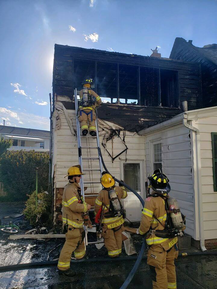 Crews from several fire departments battle an afternoon June 1 blaze at 321 Surf Rd.