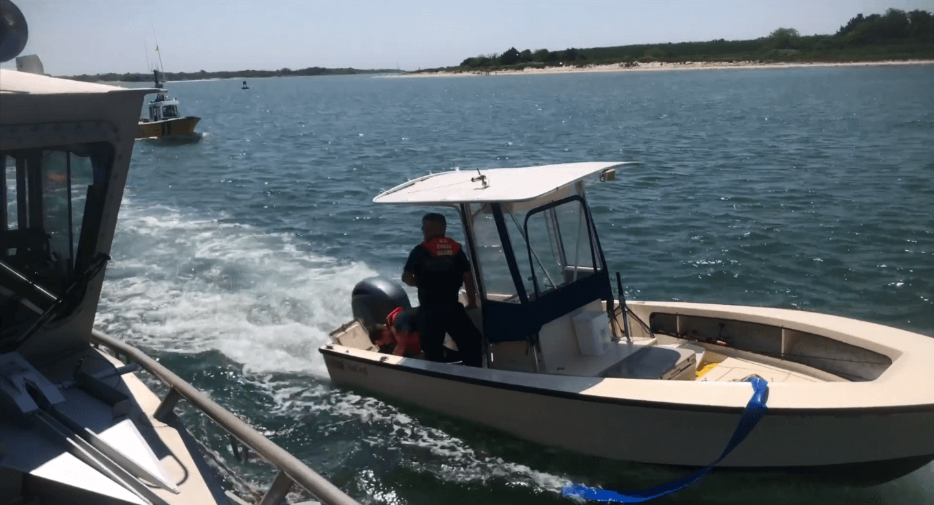 Coast Guard members and a good samaritan rescued four people from a vessel that struck a jetty near Cape May.