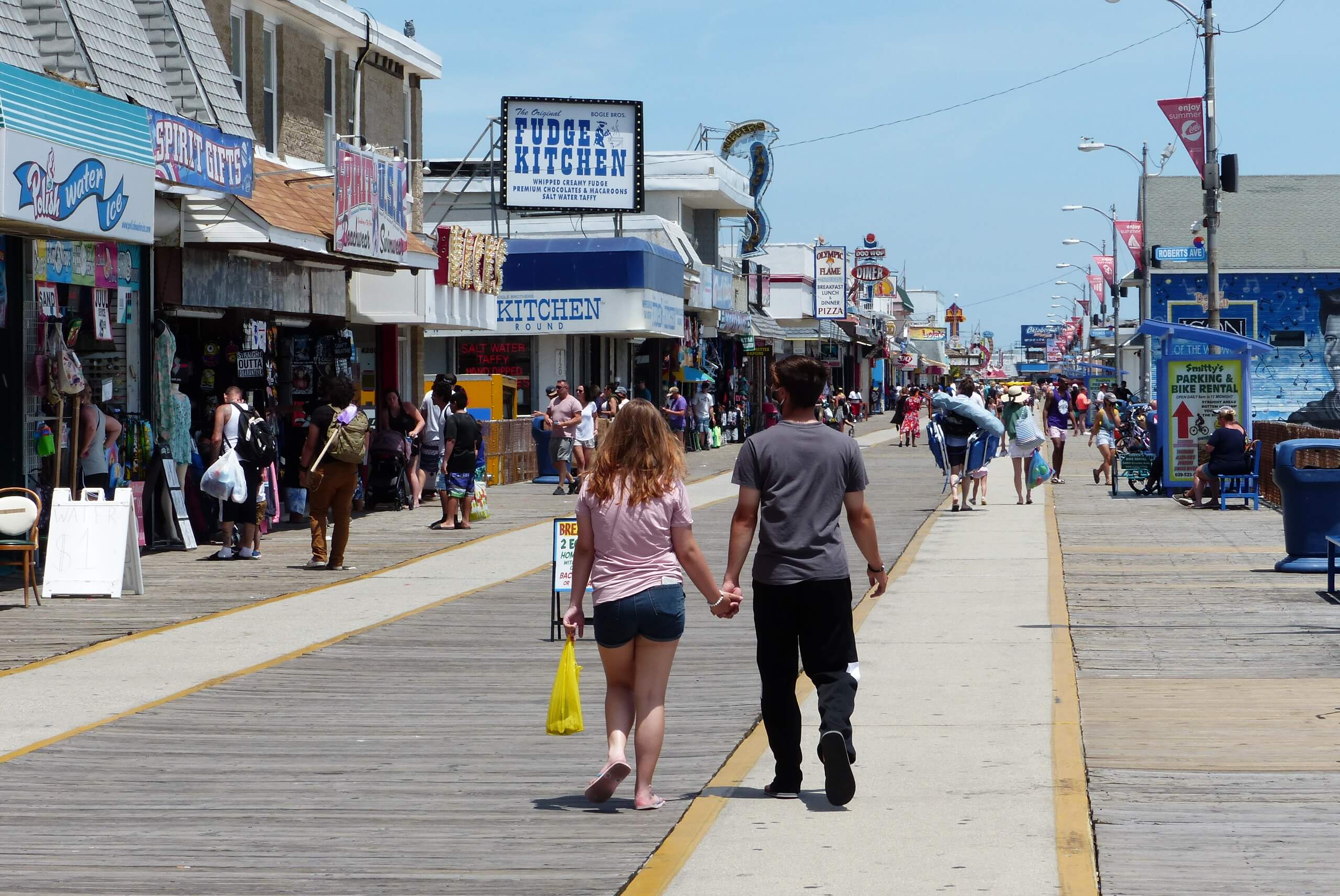 Visitors stroll the Wildwoods Boardwalk June 24. A recent travel advisory by Gov. Phil Murphy has raised questions about how it could affect the county's tourism-based economy at the height an already challenging summer. 