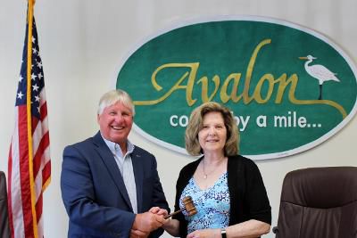 John McCorristin accepts the Avalon Council presidency from Nancy Hudanich