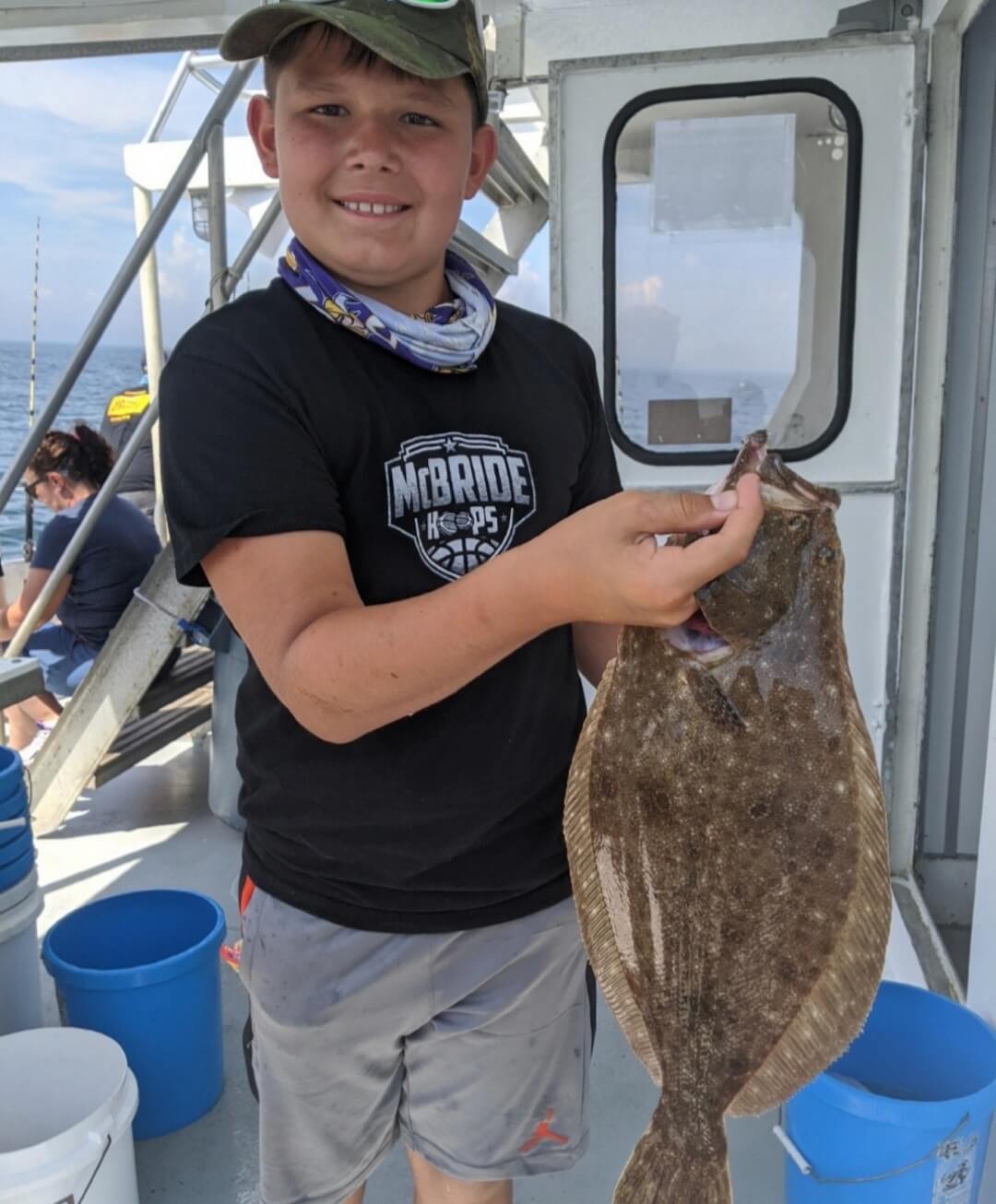 12-year-old Jackson Sargalis and his pool-winning flounder.