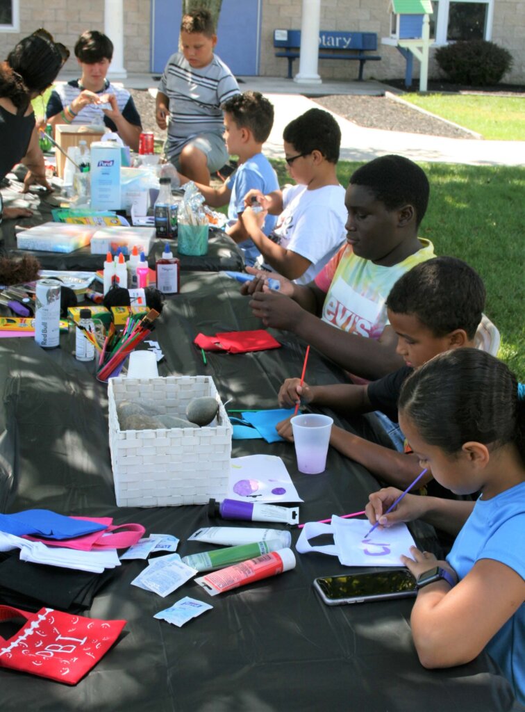 Children paint rocks