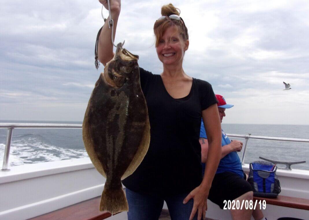 Heather Lynch and her 4.2-pound fluke.