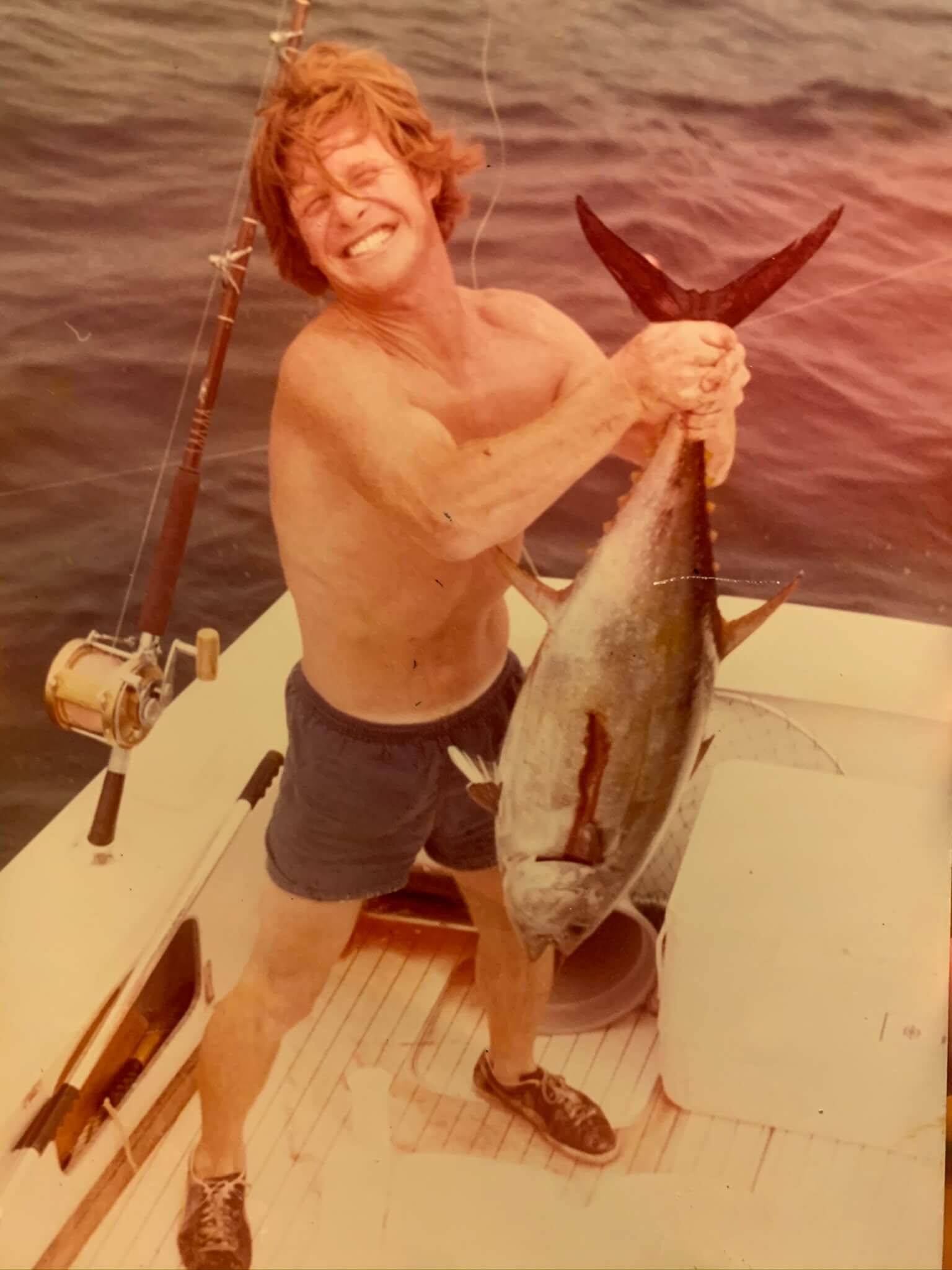 A young Rusty struggling with a heavy catch.