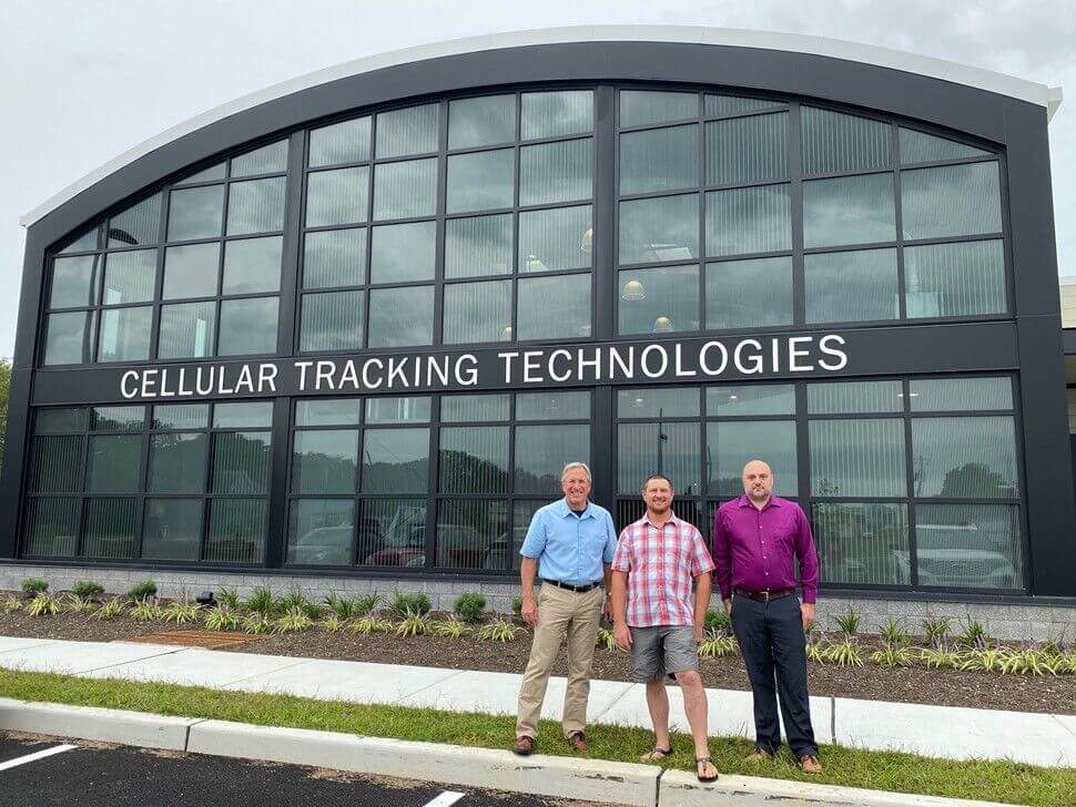 Will Morey with Michael Lanzone and Casey Halverson in front of their company