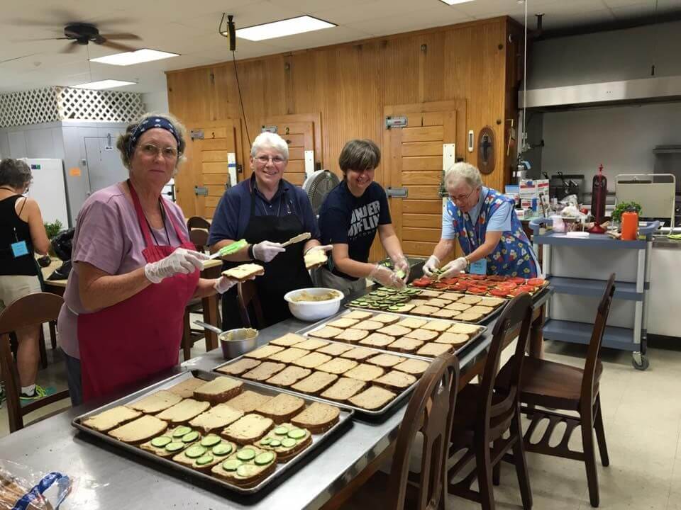 Sisters and volunteers share kitchen responsibilities and good times together. 
