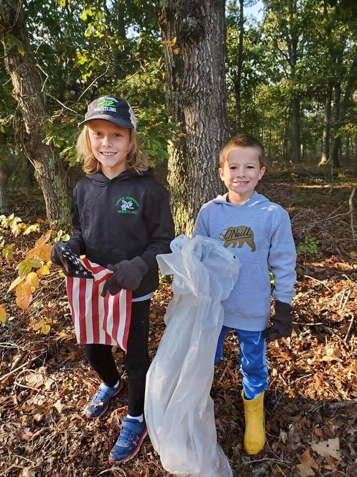Members of the Upper Township Green Hornets Wrestling Team pose for a pic after cleaning up Elmwood Ave in the Marmora section of Upper Township.