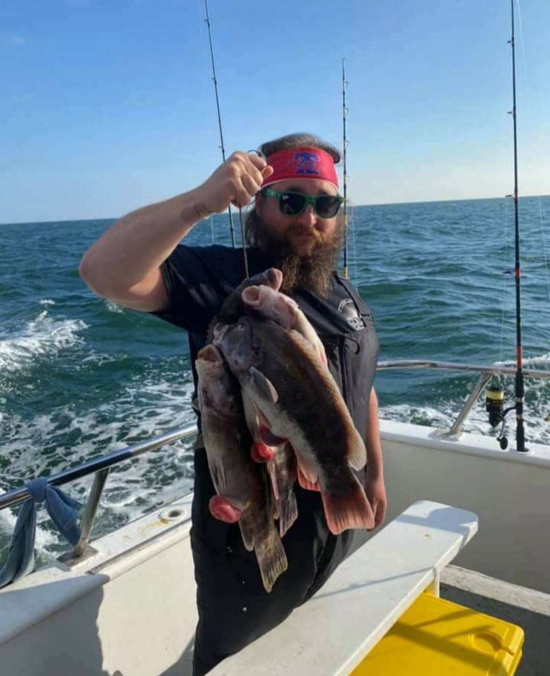 A happy angler and his blackfish stringer.